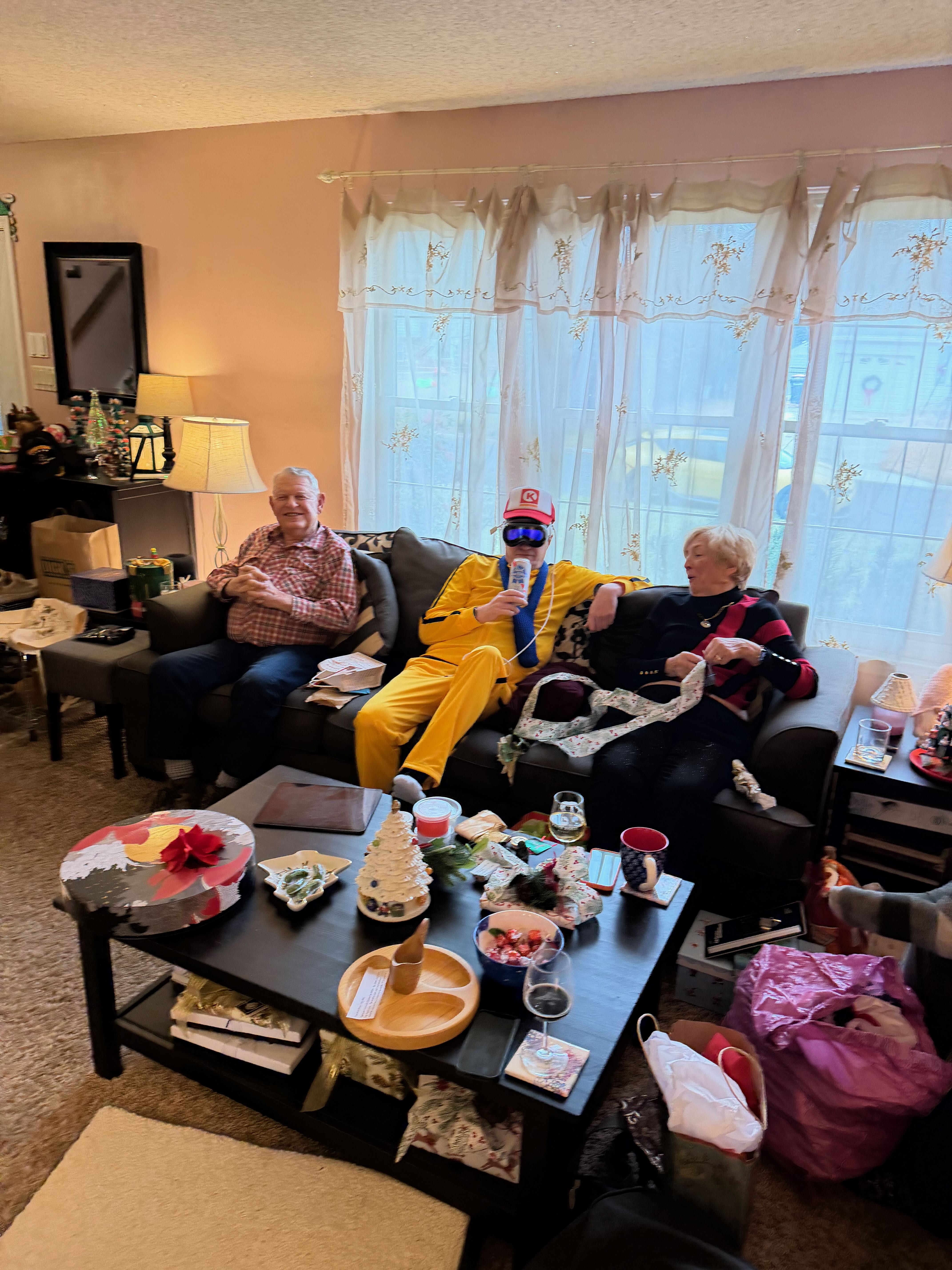 A funny candid photo of Steve hanging out with his in-laws in a living room.